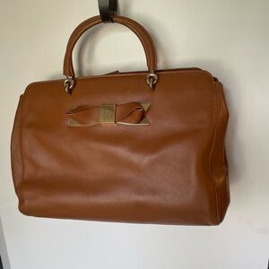 SPRING SALE’. Ted Baker leather satchel with bow trim.